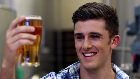 brewery worker checking the product