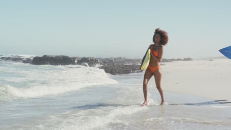 african american couple ready to go surf