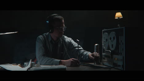 an intelligence officer is working at the wiretap station
