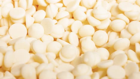 white chocolate chips moving in a pile