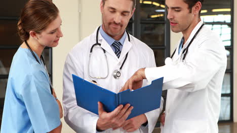 doctors looking at documents