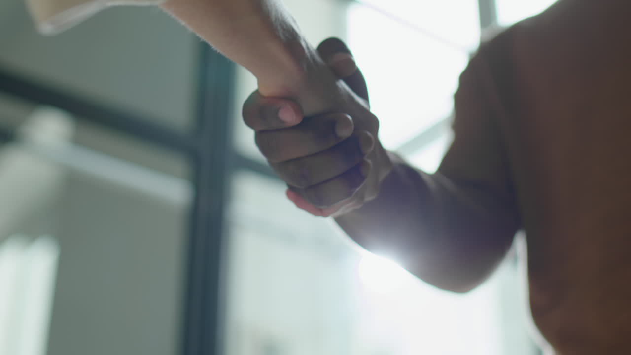 Business People Talking after Handshake in Office