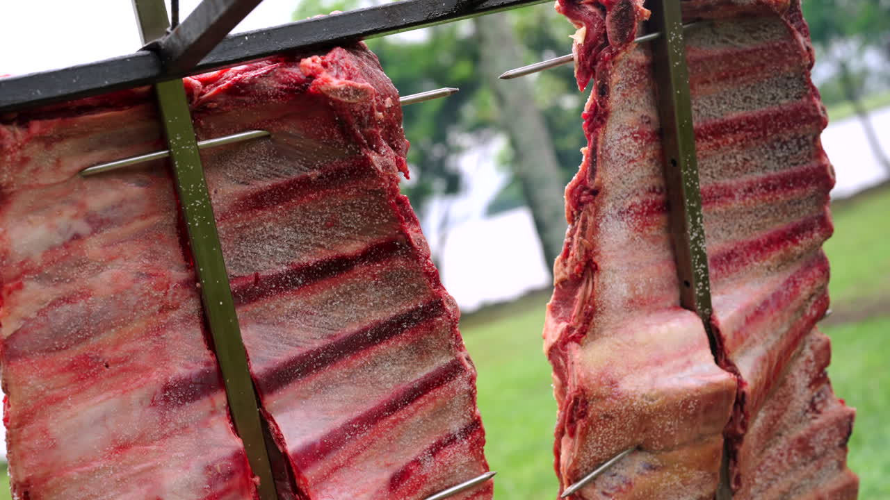 Argentinian barbecue with traditional meat cuts roasting on parrilla, cultural and culinary heritage