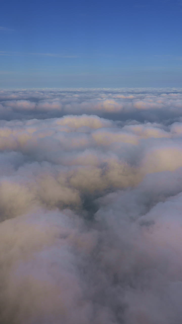 Serene Aerial View of Fluffy Clouds and Blue Sky
