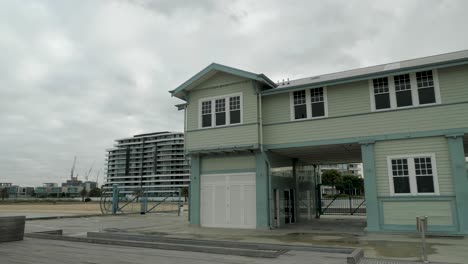 green wooden building on the beach