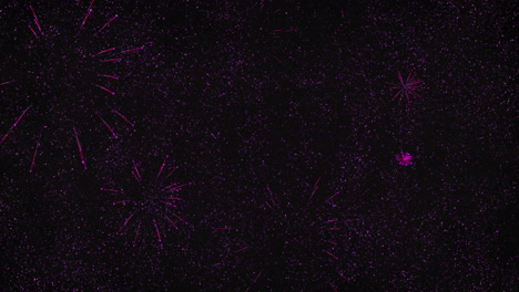 Animation of 2022 and pink fireworks exploding on black background
