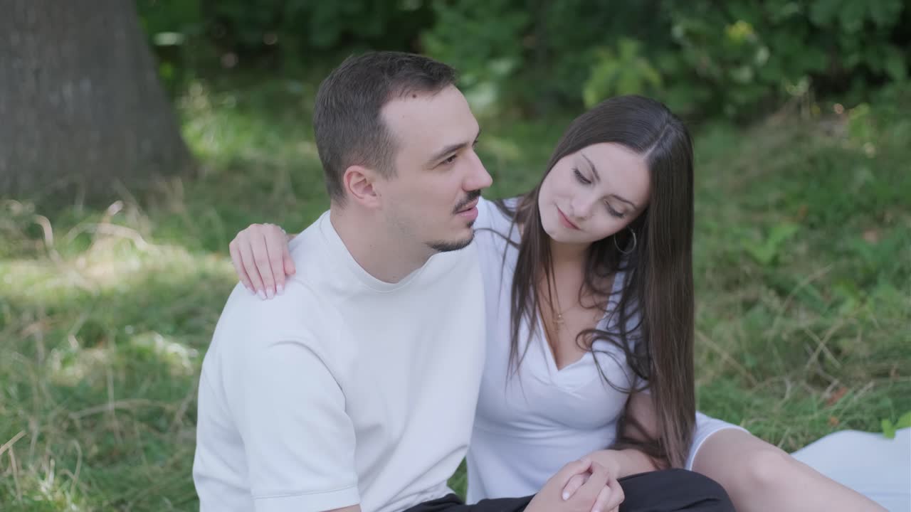 Couple in love sitting in the park