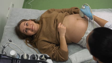 pregnant woman laying on stretcher