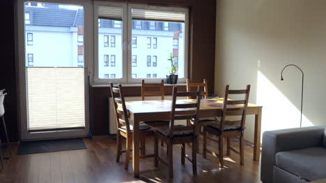 static shot of empty table in living room during sunny day in house