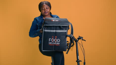 courier unloading food delivery bag