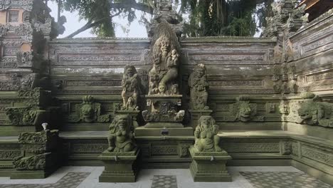 stone carvings of religious idols guarding at a balinese temple