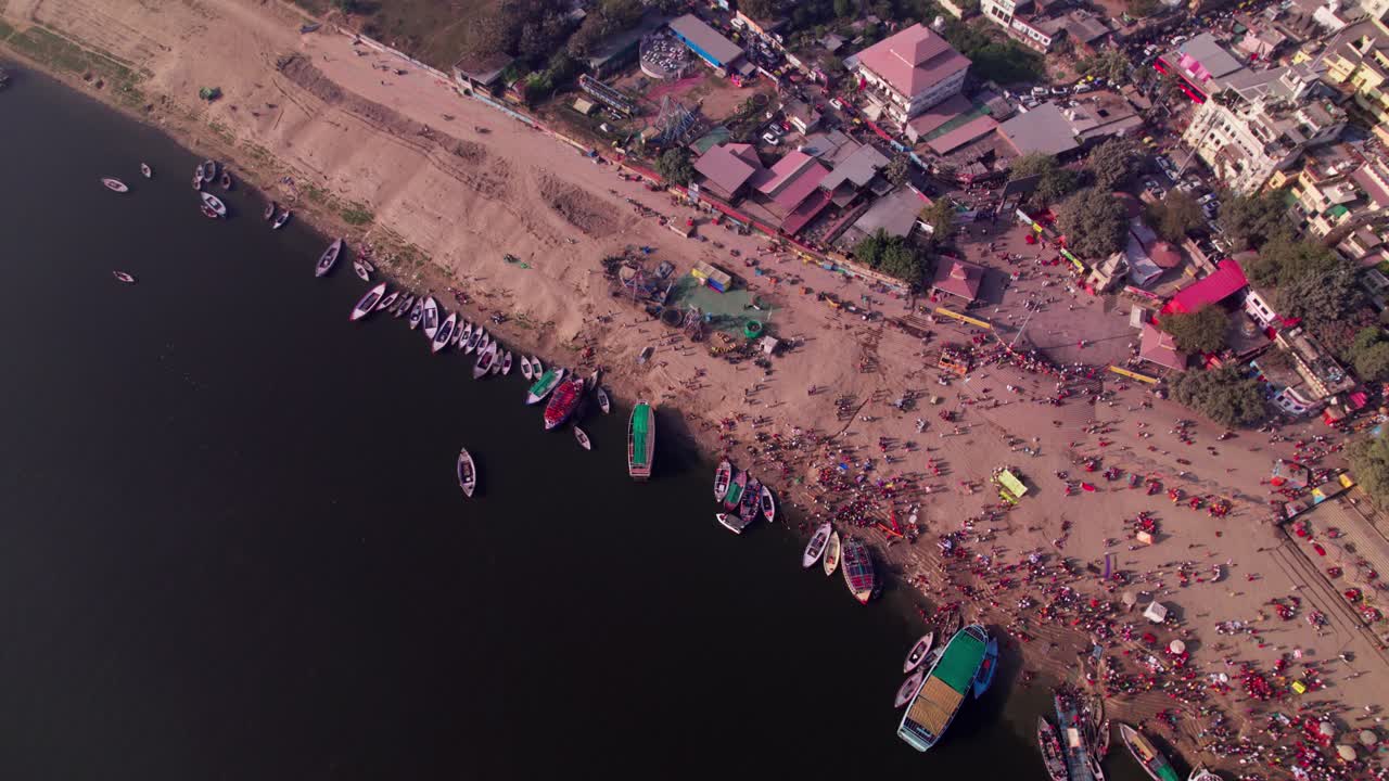 assi ghat with ganga river and boats at kashi, varanasi, uttar pradesh, india. day time, top down, drone shot, 4k.