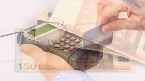 Animation-of-euro-banknotes-falling-over-hand-of-caucasian-man-holding-payment-terminal