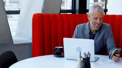 Businessman-using-mobile-phone-in-hotel-4k