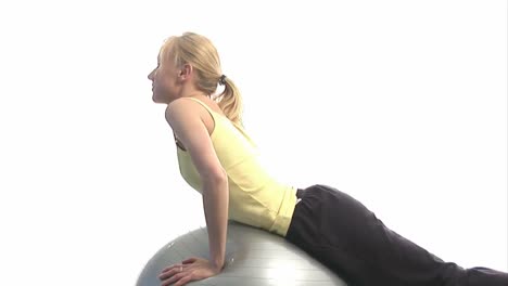 young woman excercising with ball