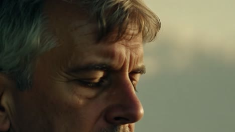 close-up portrait of a thoughtful older man