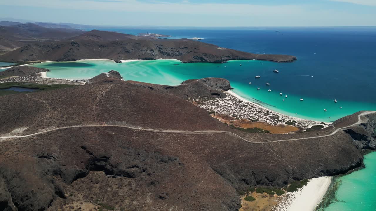The beautiful tecolandra beach, turquoise waters and rugged hills in la paz, mexico, aerial view