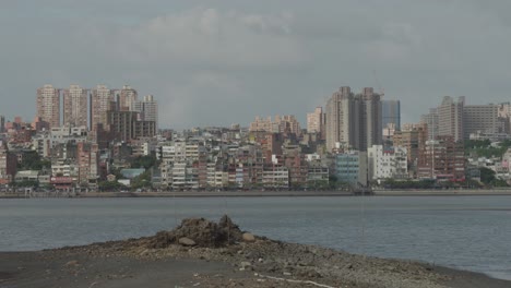 cloudy sky over tamsui district skyline in new taipei city, taiwan