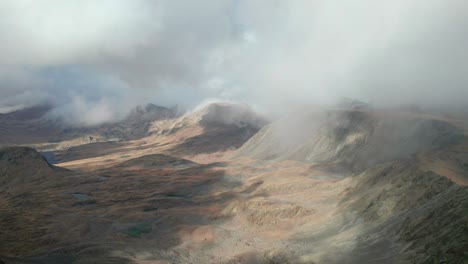 aerial view of cloudy mountains in french pyrenees during autumn