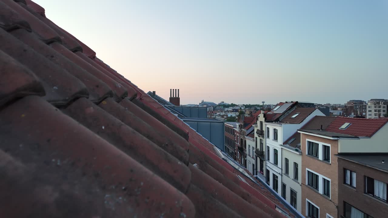 Red rooftops of Brussels in soft evening summer light