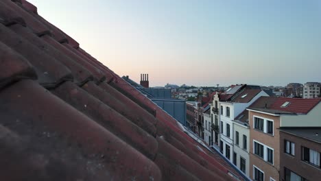 red rooftops of brussels in soft evening summer light