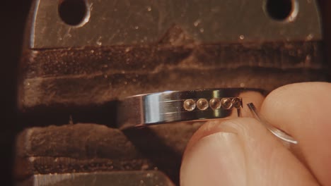 close-up of a jeweler working on a ring