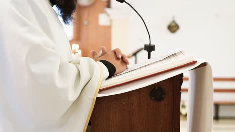 Preacher-Explaining-Holy-Bible-At-Altar-During-Wedding-Ceremony