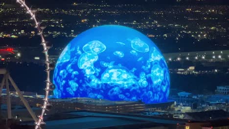 Las-Vegas-Sphere-showing-animated-Jellyfish-in-the-ocean-swimming-at-night
