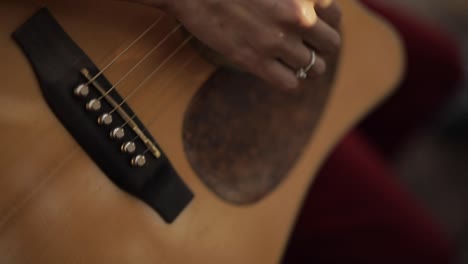 crop musician playing guitar in street