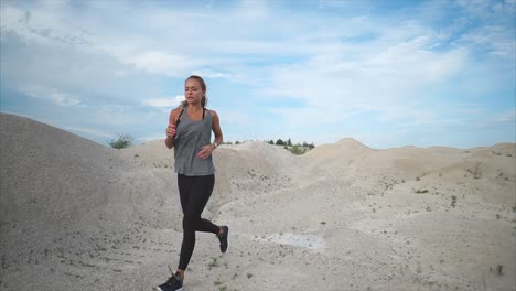 woman running in a desert landscape
