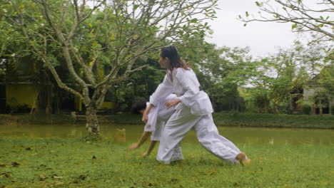 couple practising martial arts together