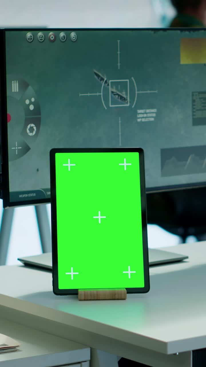 Vertical Video Soldier gathering real time surveillance data next to mockup display