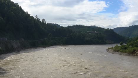 A-flooding-river-in-the-shadow-of-the-hills-of-Nepal