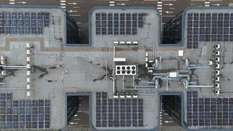 drone shot of office building roof with solar panels, heating, ventilation and air conditioning equipment