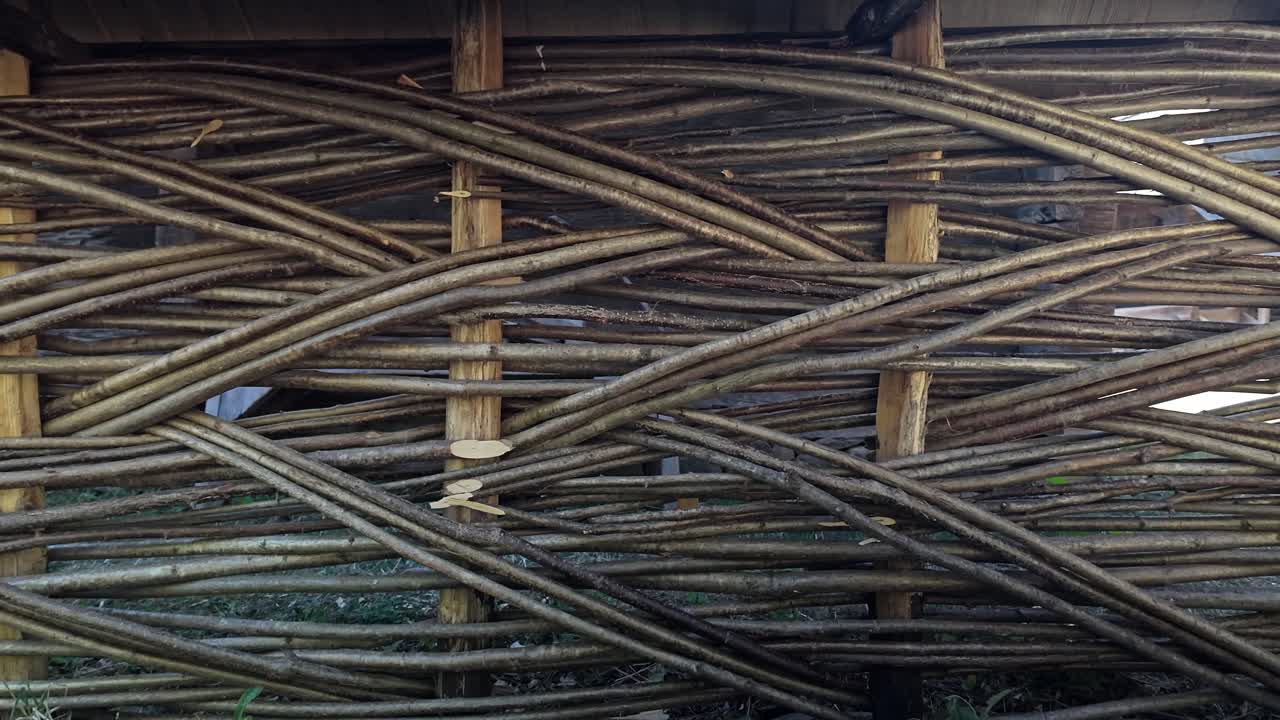 Traditional folk style wooden wattle lattice fence enclosure CLOSE-UP