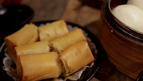 assorted dim sum dishes in bamboo steamers