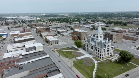 marshall county historic courthouse in marshalltown, iowa with drone video moving down