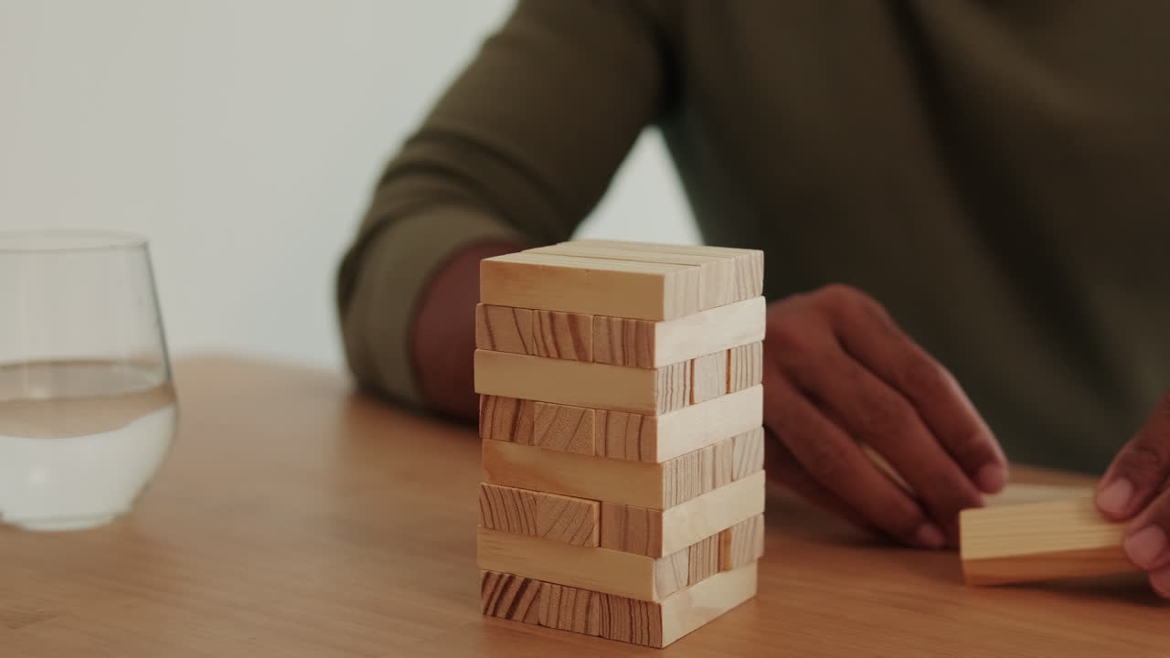 Couple Plays Jenga At Home