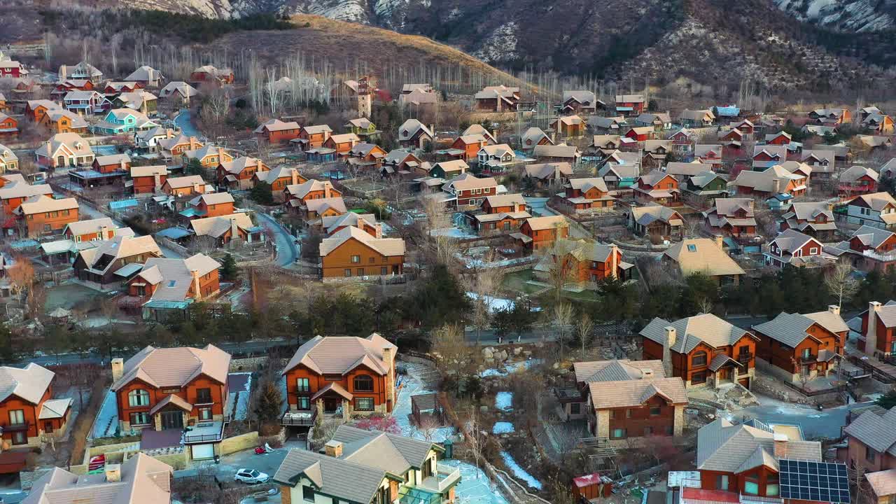 Aerial flyover of the charming Jackson Hole near Beijing, China, with architecture inspired by Jackson, Wyoming, USA. A Chinese Copy Town