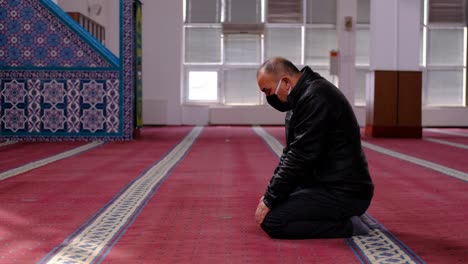 Older-Man-Wears-Mask-And-Turns-His-Head-Mosque-1