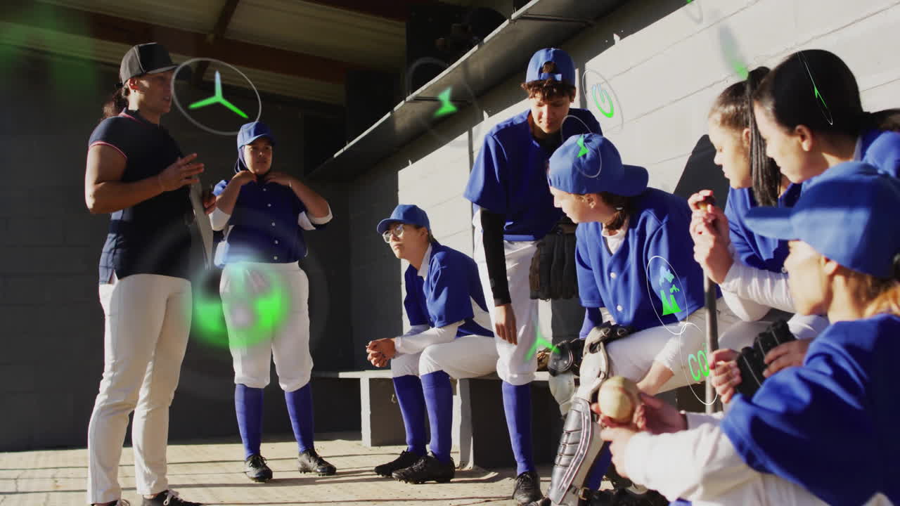 In school, baseball team in blue uniforms listening to coach with animation