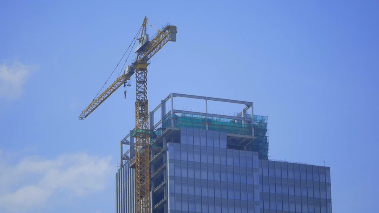 A Crane is currently building a skyscraper