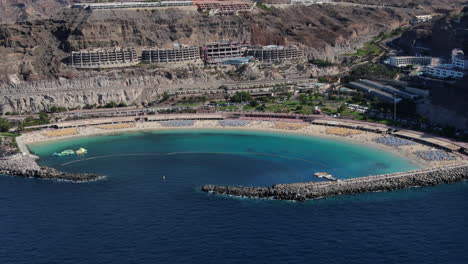 aerial view travelling out to amadores beach and the resorts near the coast