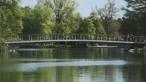 some people walking over on the bridge but sometimes they look around on it