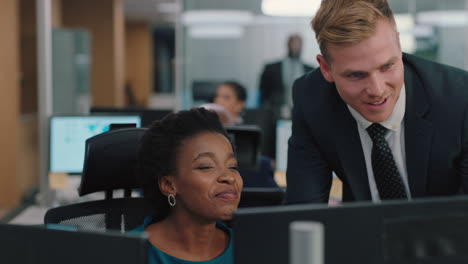 businessman meeting with colleague using computer team leader man pointing at screen helping coworker discussing strategy in corporate workplace