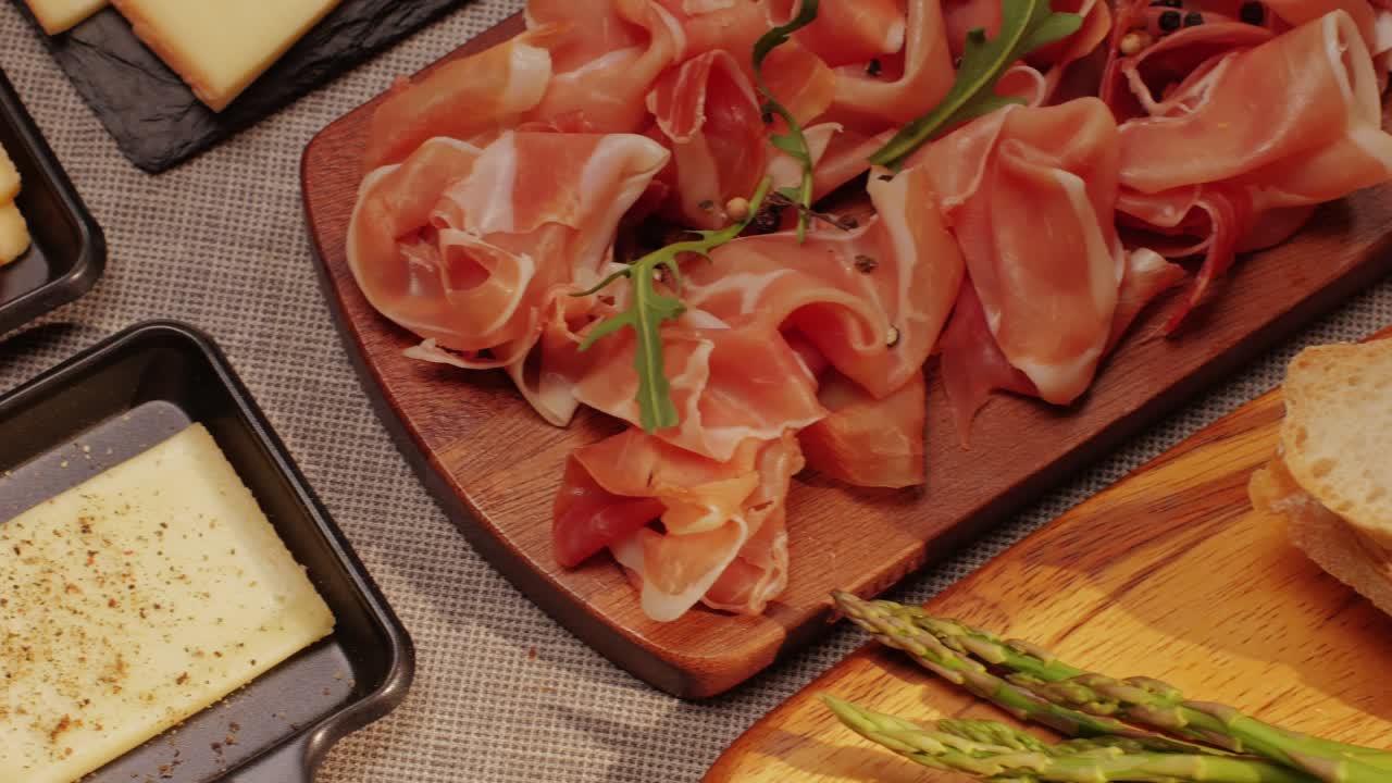 Italian or Spanish restaurant with traditional tapas food, Spanish cuisine, delicious tapas and cheese plate, bruschetta with cheese, olives dry tomatoes and tasty sandwich bar appetizer, buffet