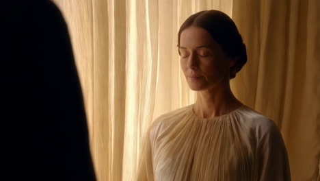 a serene woman meditating or deep in thought