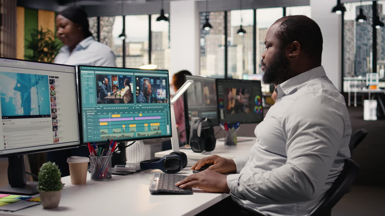 Black man working on film footage editing and cutting clips for motion graphics