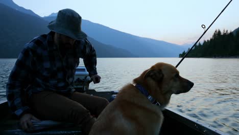 fishermen travelling with his dog in the boat 4k