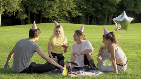 birthday party. happy teenager girl with cake with candles 17, celebrating birthday with friends